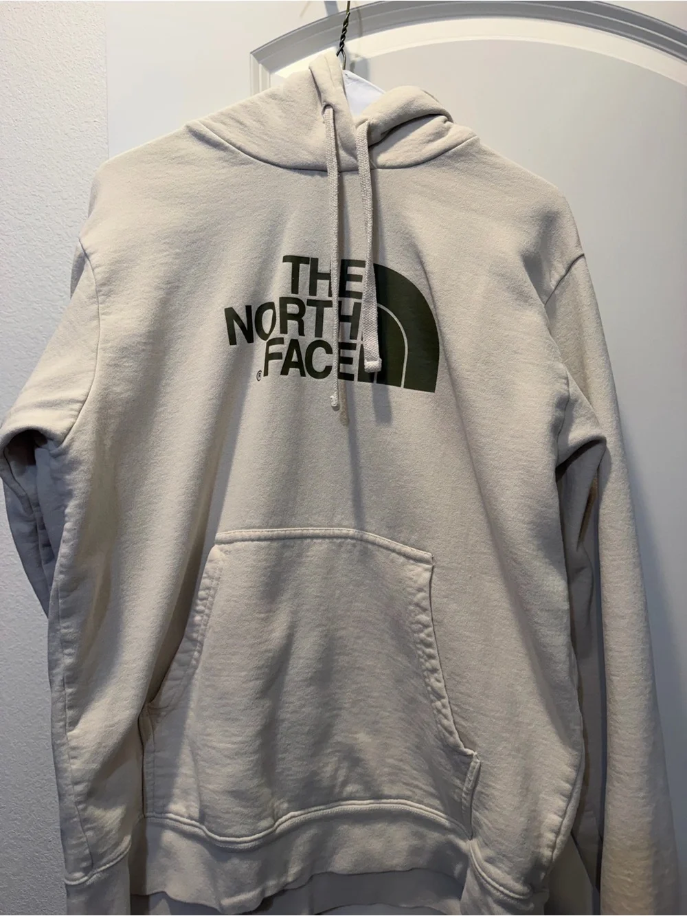 The North Face Light Beige Hoodie with Dark Green Logo